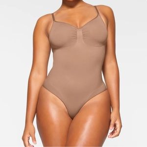 Skims Seamless Sculpt Brief Bodysuit in color Sienna